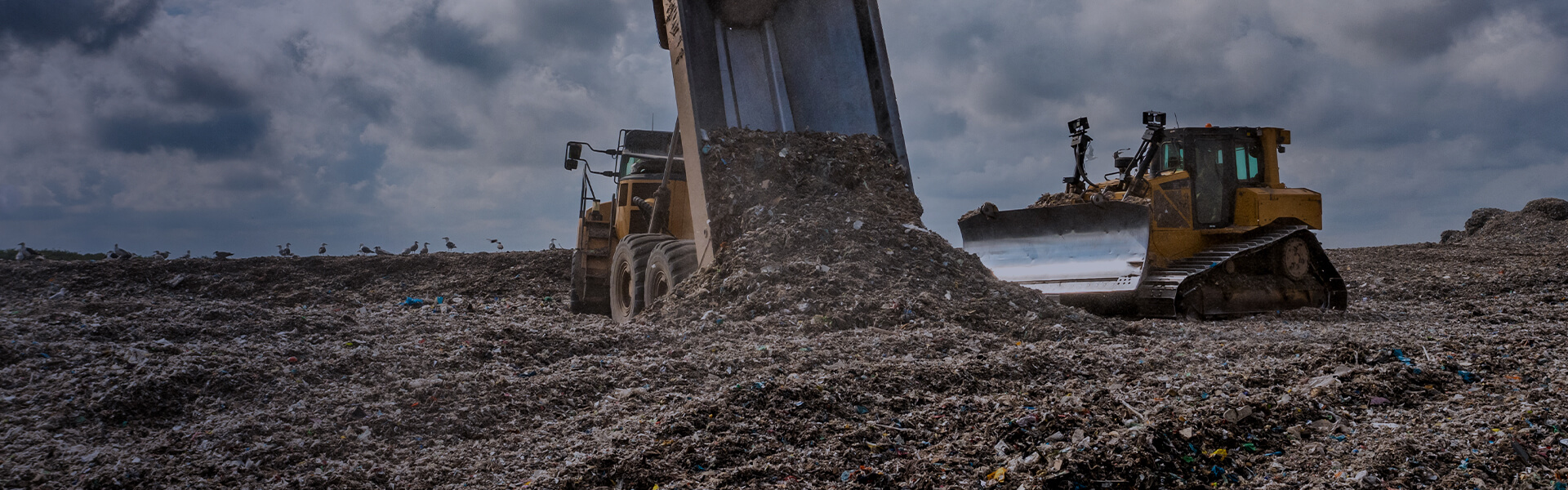 Image of a tipper truck tipping waste onto landfill site