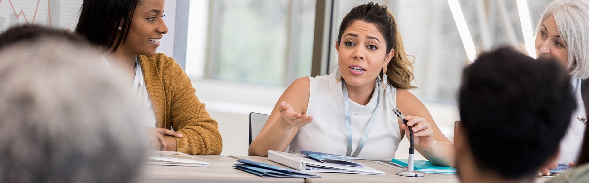 Female in a professional office environment engaging in a discussion
